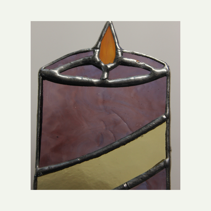 detail view of the stained glass candle front